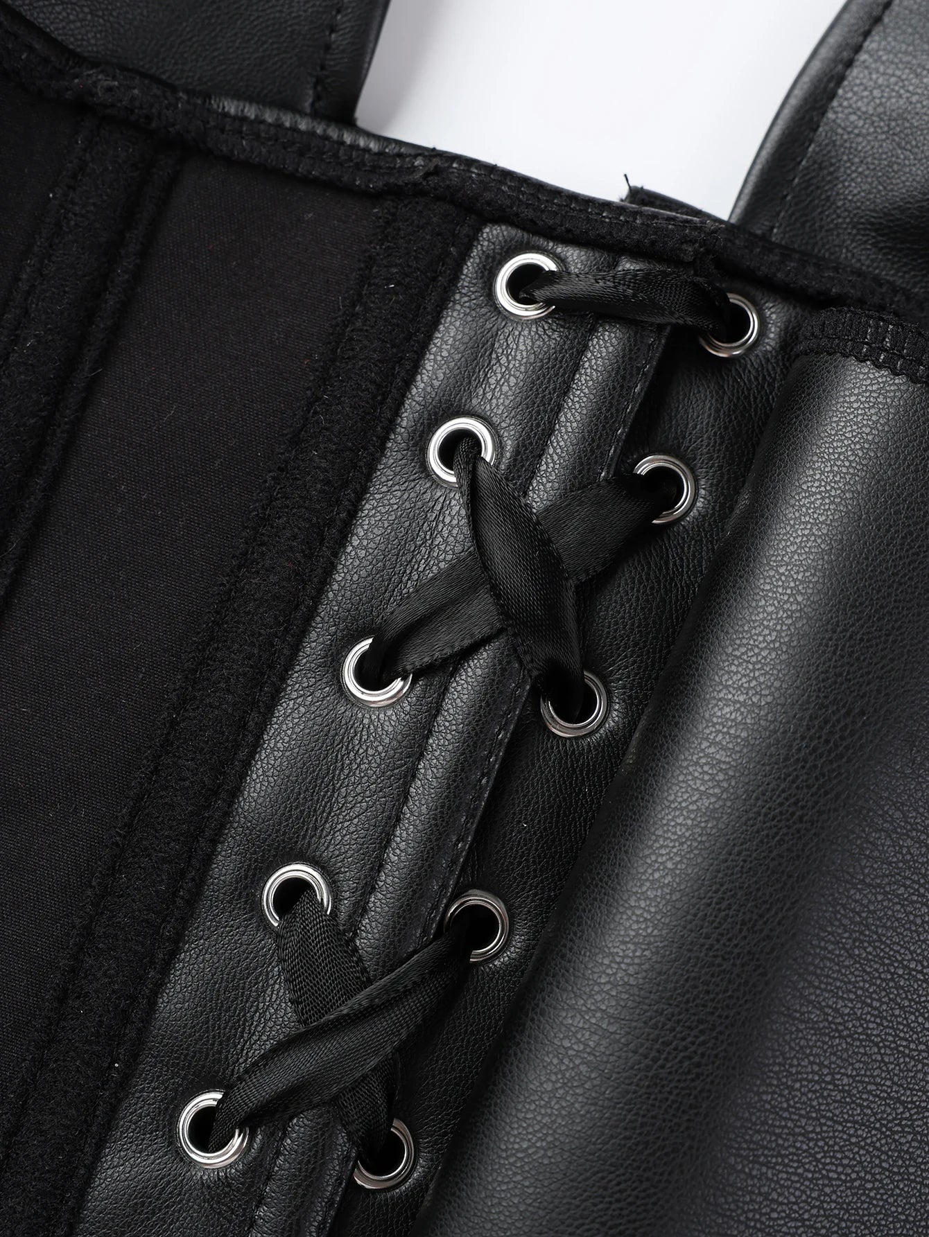 Punk girl collar style faux leather corset with multiple straps and fish bone elastic waistband for shaping the body. Tight top.