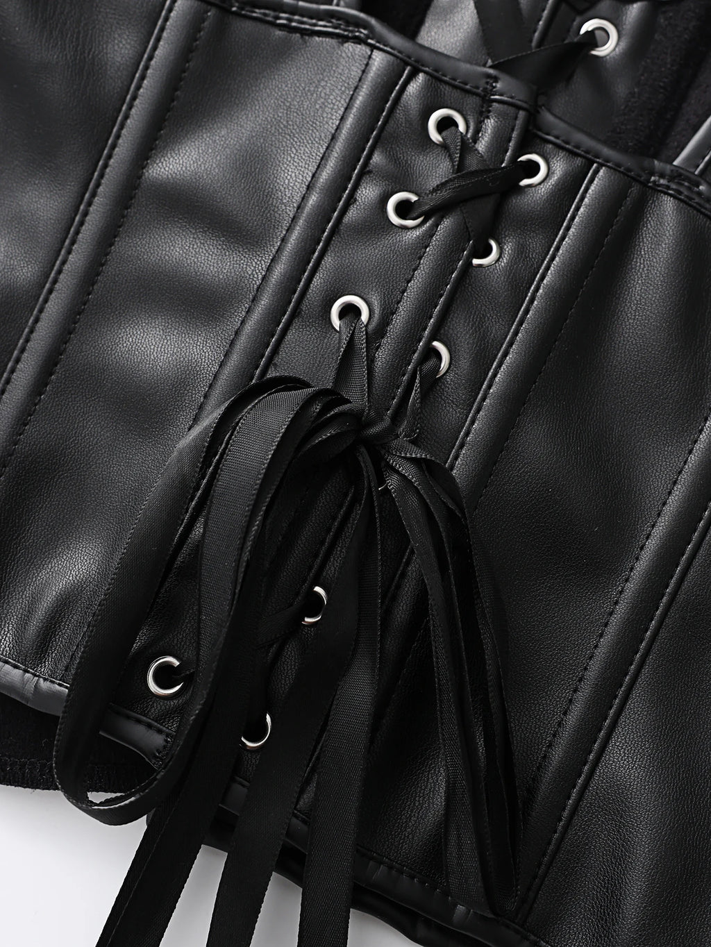 Punk style genuine leather blazer with wide shoulder straps and front ties for waist cinching and shaping. Short, tight corset.