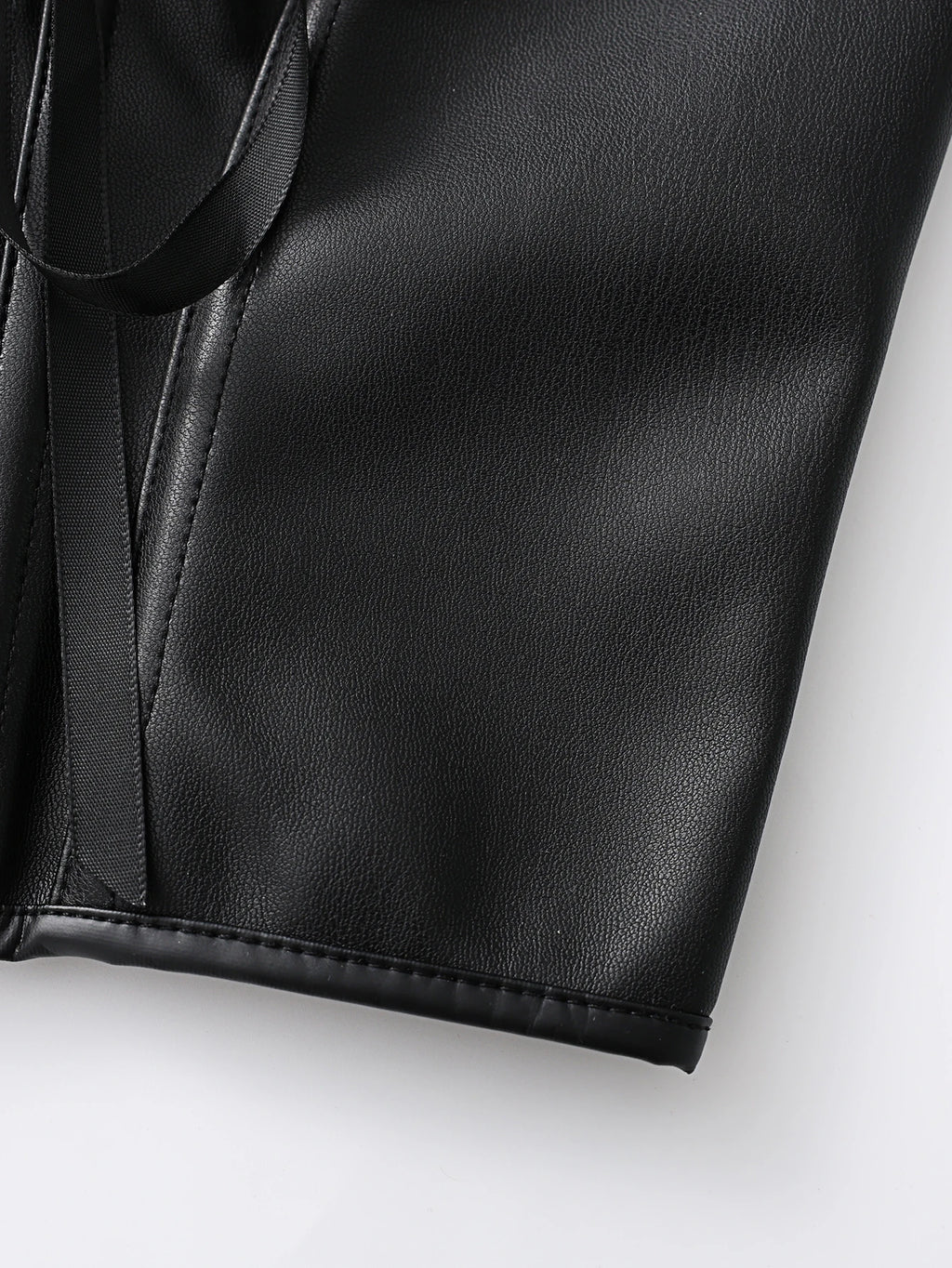 Punk style genuine leather blazer with wide shoulder straps and front ties for waist cinching and shaping. Short, tight corset.