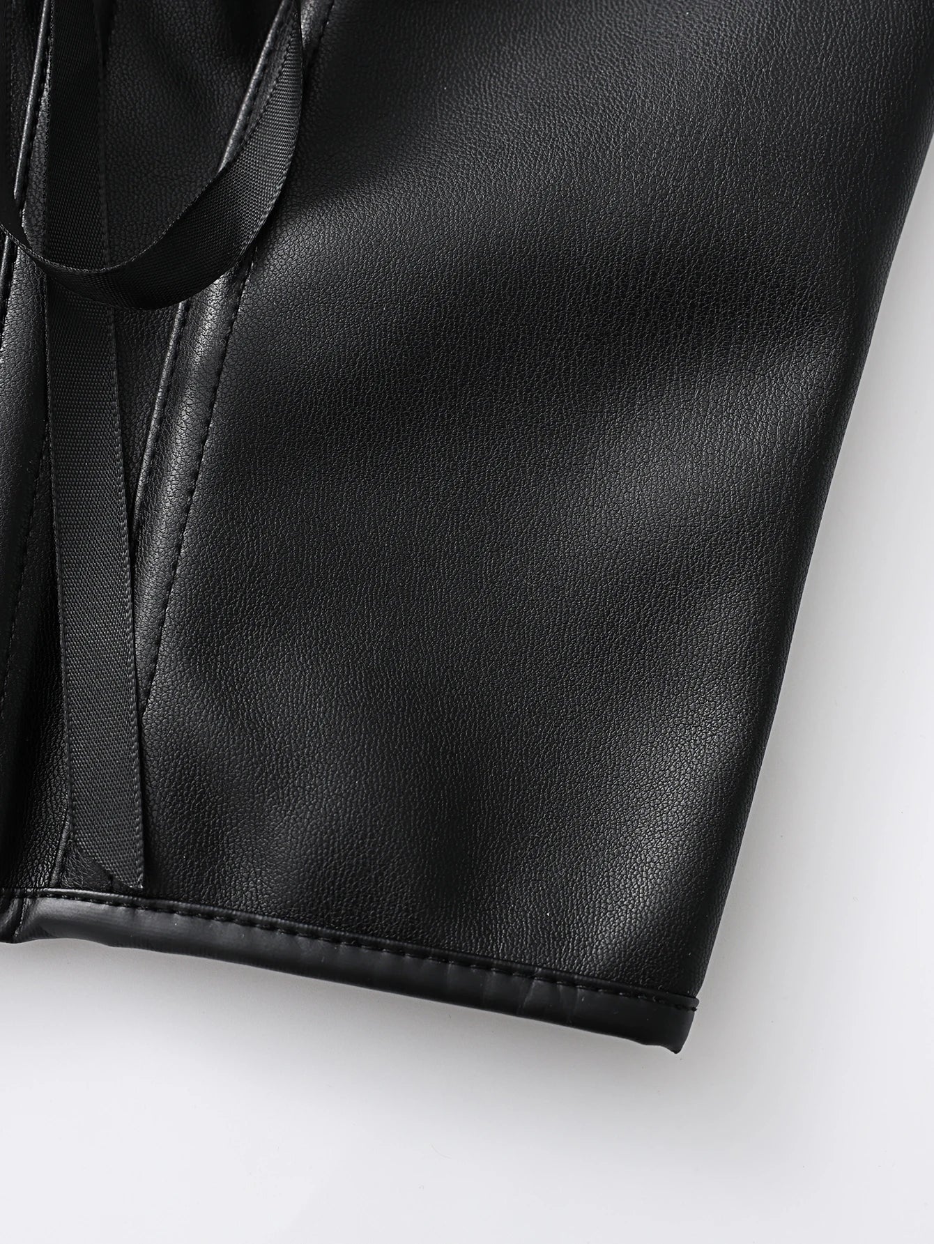 Punk style genuine leather blazer with wide shoulder straps and front ties for waist cinching and shaping. Short, tight corset.