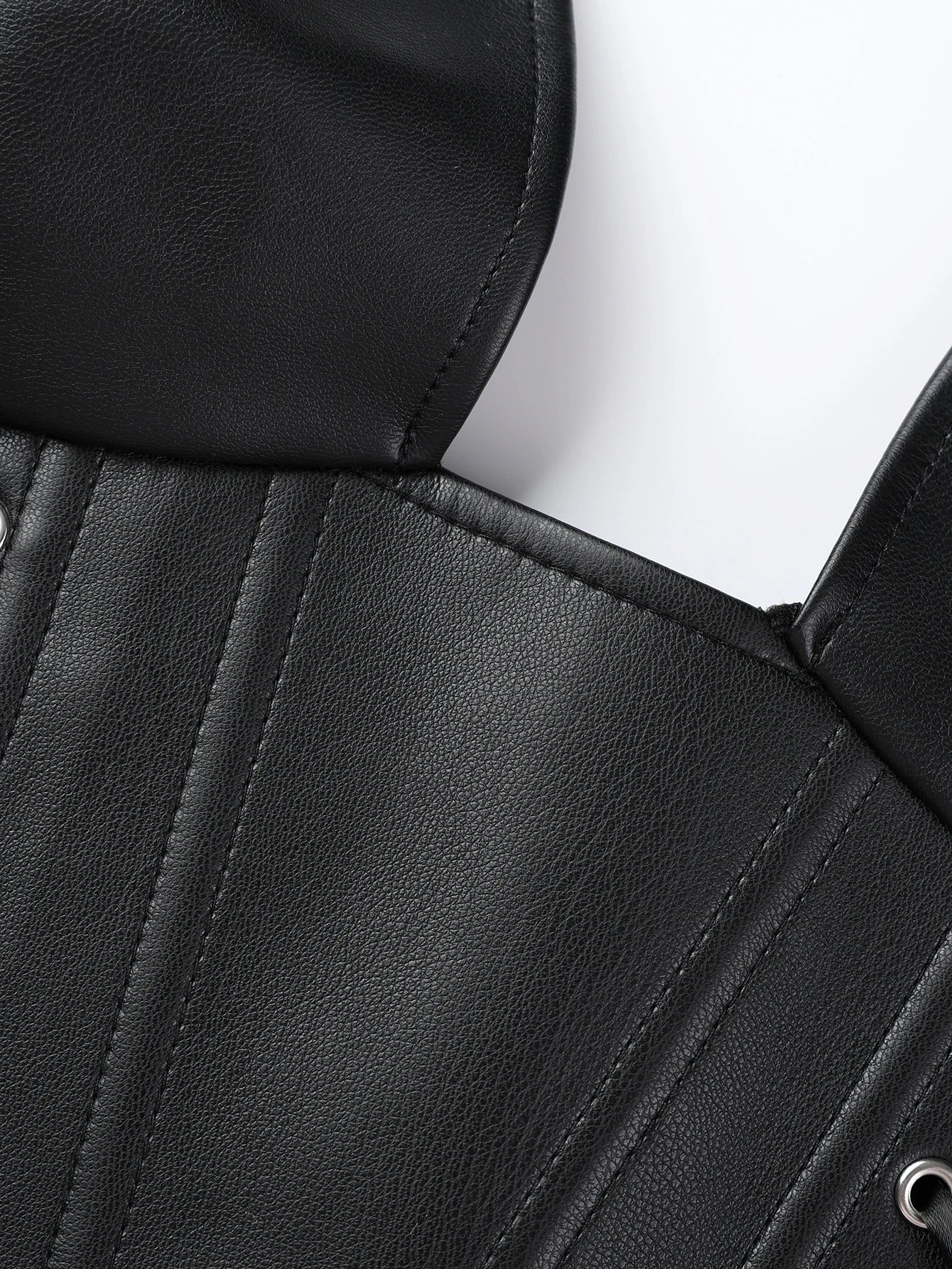 Punk girl collar style faux leather corset with multiple straps and fish bone elastic waistband for shaping the body. Tight top.